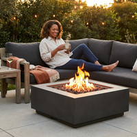 Brookhurst 42 In. L X 12 In. H Outdoor GFRC Liquid Propane Fire Pit in Carbon with Lava Rocks — Lifestyle